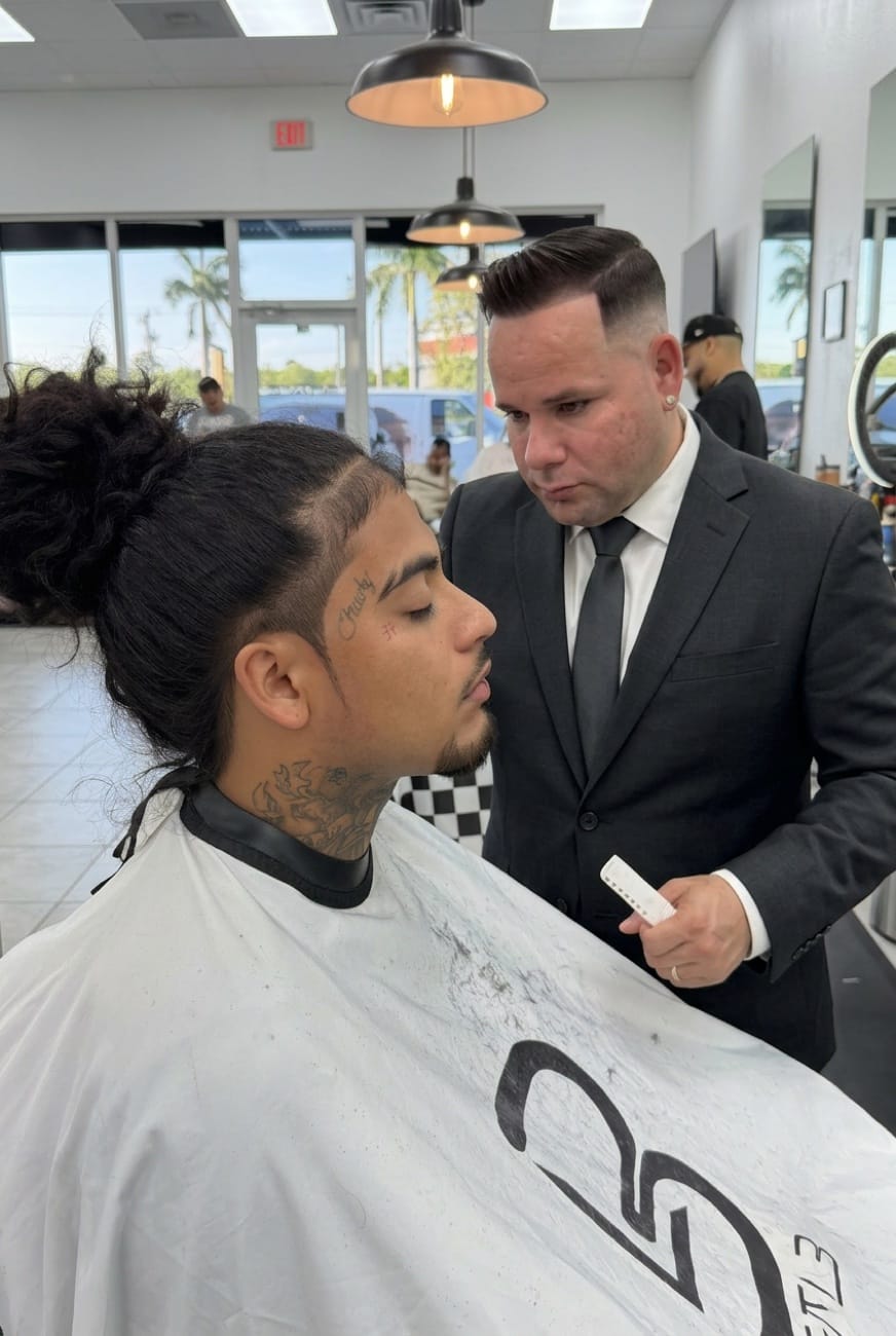 Master barber cutting hair at Barbershop in Cape Coral, FL